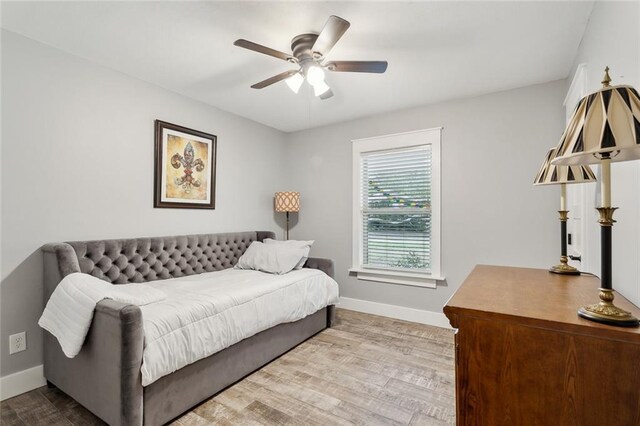 bedroom featuring ceiling fan and wood-type flooring