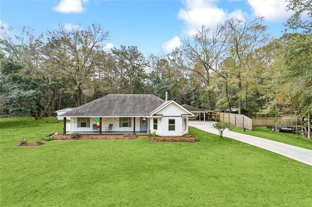 single story home featuring a front lawn, a porch, and a carport