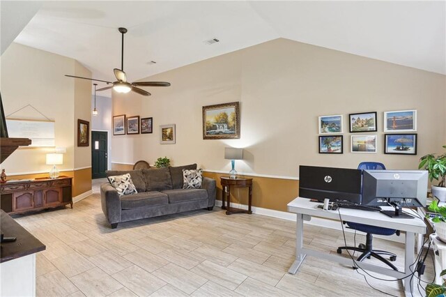 office with lofted ceiling and ceiling fan