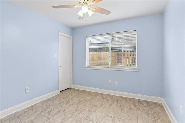 spare room featuring ceiling fan