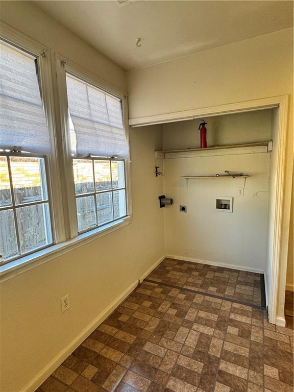 clothes washing area featuring washer hookup and electric dryer hookup