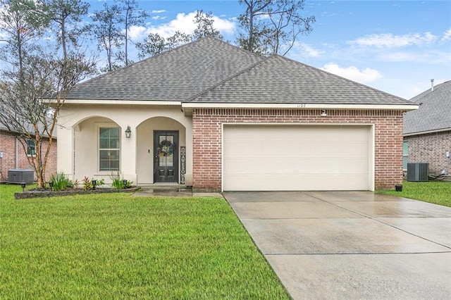 ranch-style house featuring central AC unit, a garage, and a front yard