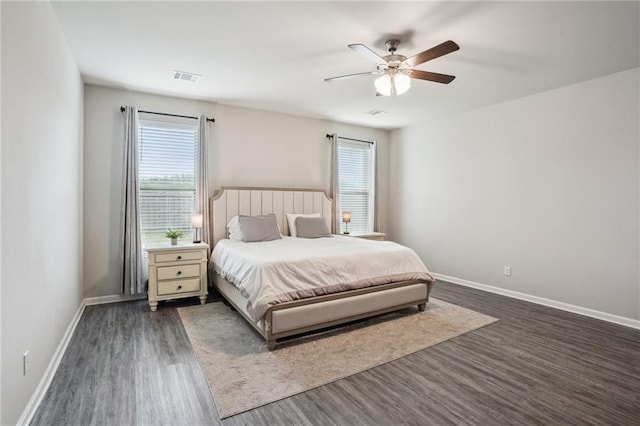 bedroom with ceiling fan and dark hardwood / wood-style floors