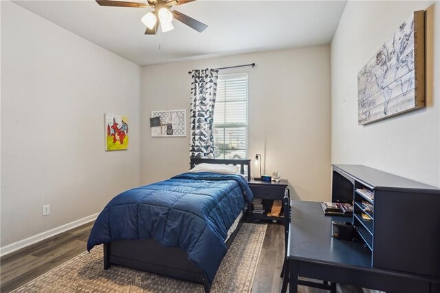 bedroom with ceiling fan, dark hardwood / wood-style floors, and multiple windows