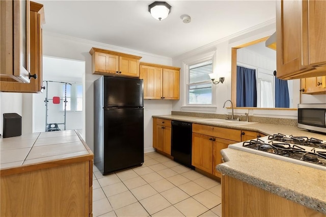 kitchen with black appliances, light tile patterned floors, sink, and crown molding