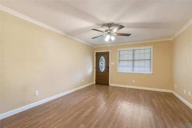 foyer entrance featuring ceiling fan, ornamental molding, and hardwood / wood-style floors