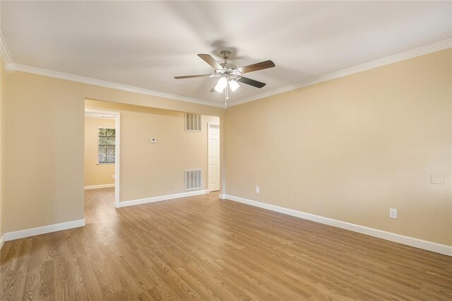 spare room with ceiling fan, ornamental molding, and hardwood / wood-style floors