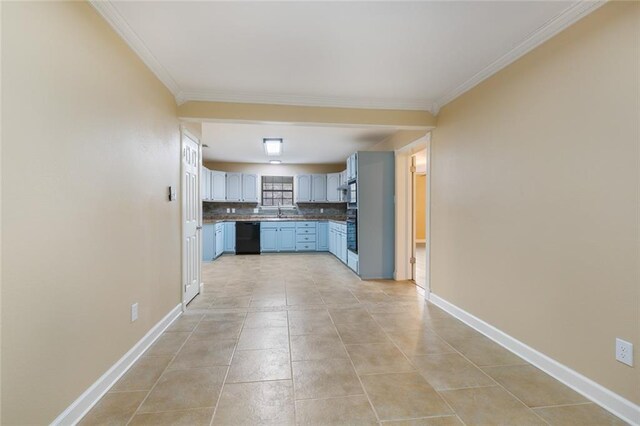 kitchen featuring light tile patterned floors, backsplash, black dishwasher, and crown molding