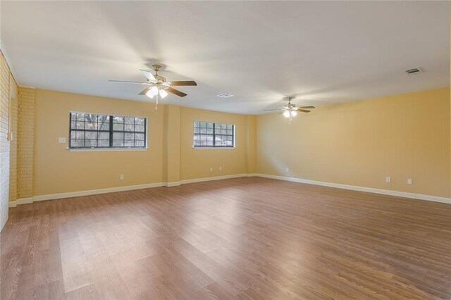 spare room featuring ceiling fan and wood-type flooring