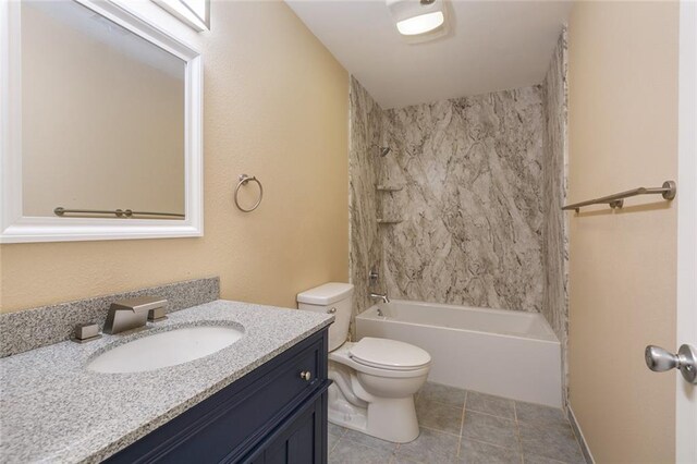 full bathroom featuring toilet, tile patterned flooring, vanity, and shower / bathing tub combination