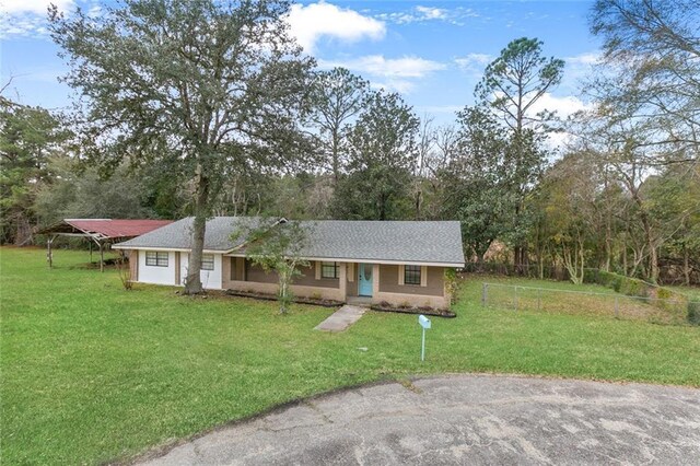 ranch-style home with a front yard