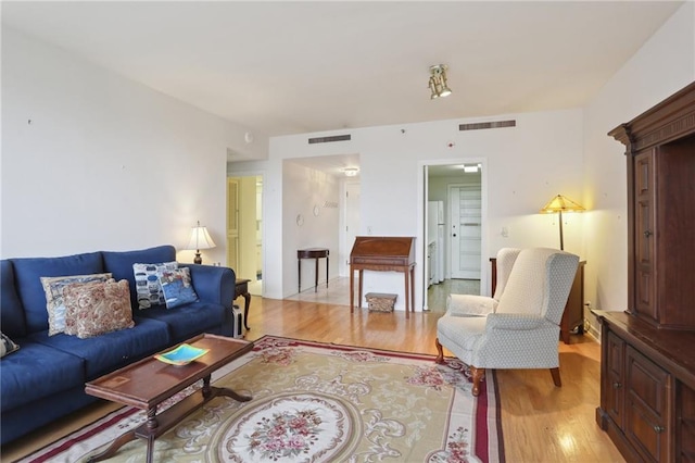 living room with light hardwood / wood-style flooring