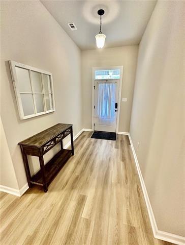 entryway with light hardwood / wood-style floors