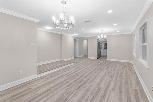 unfurnished living room featuring light wood-type flooring, crown molding, and a notable chandelier