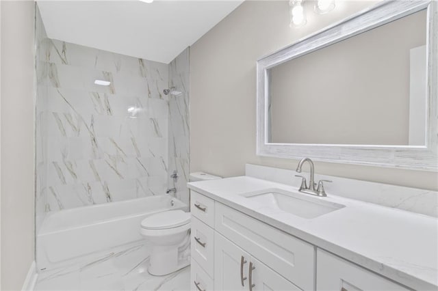 full bathroom featuring toilet, tiled shower / bath, and vanity