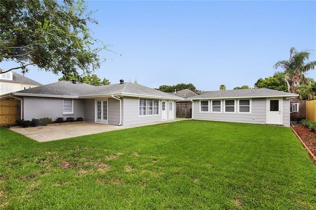 553 Crystal St, New Orleans, LA 70124 - back of house with a yard, a patio, a fenced backyard, and french doors