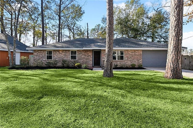 ranch-style home featuring a front yard and a garage