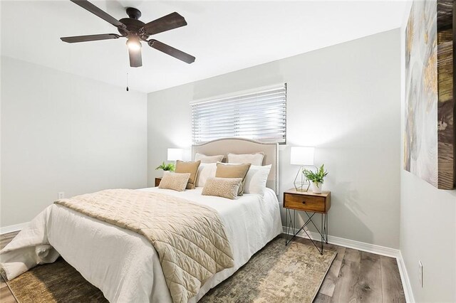 bedroom featuring ceiling fan and hardwood / wood-style flooring