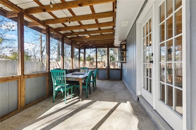 sunroom / solarium featuring lofted ceiling