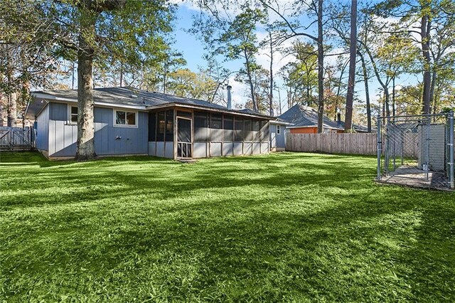 view of yard with a sunroom