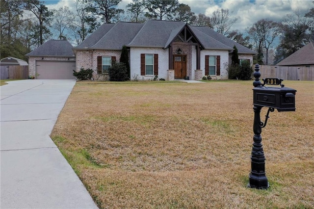 view of front facade featuring a front yard and a garage