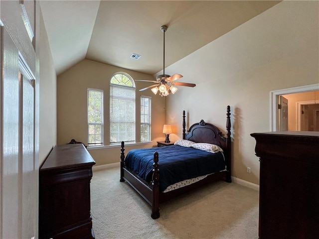 bedroom with lofted ceiling, light colored carpet, and ceiling fan