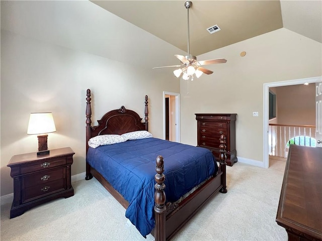 bedroom with lofted ceiling, light colored carpet, and ceiling fan