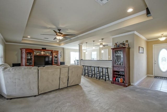 111 Judy Ct, Montz, LA 70068 - living area featuring plenty of natural light, ceiling fan, carpet, crown molding, and a tray ceiling