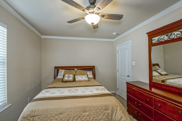 bedroom featuring ceiling fan and crown molding