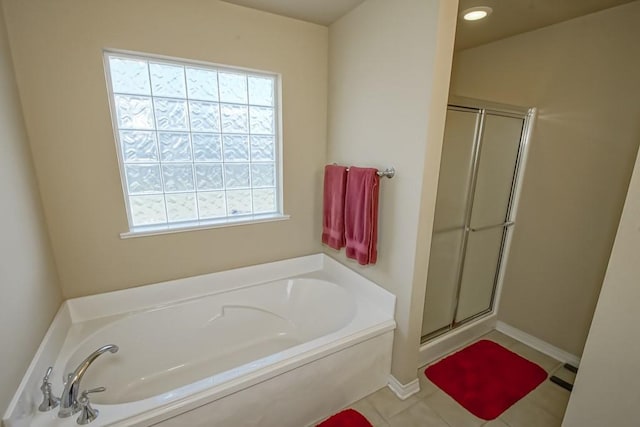 111 Judy Ct, Montz, LA 70068 - bathroom featuring healthy amount of natural light, a shower stall, a bath, tile patterned floors, and recessed lighting
