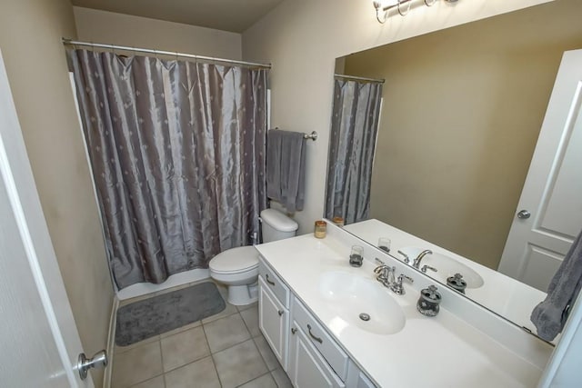 bathroom featuring toilet, vanity, and tile patterned floors