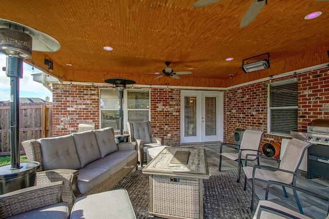 view of patio / terrace with ceiling fan, an outdoor living space, and french doors