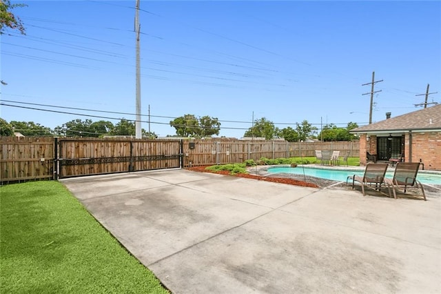 view of patio / terrace featuring a fenced in pool