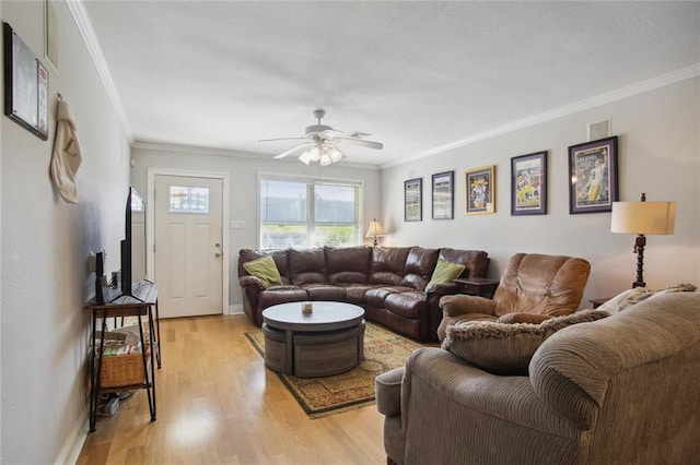 living room featuring light hardwood / wood-style floors, ornamental molding, and ceiling fan