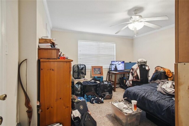 carpeted bedroom with ceiling fan and crown molding