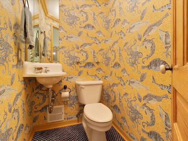 bathroom featuring visible vents, wallpapered walls, toilet, and tile patterned floors