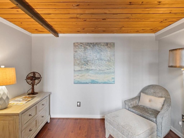 sitting room with baseboards, wood ceiling, ornamental molding, dark wood-type flooring, and beam ceiling