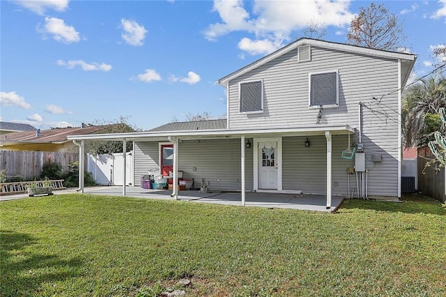 back of property featuring a yard, a patio, and cooling unit