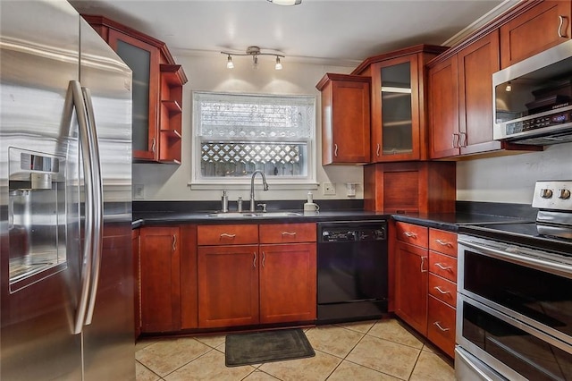 kitchen with light tile patterned floors, sink, and stainless steel appliances