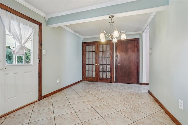 tiled foyer entrance with crown molding, french doors, and an inviting chandelier