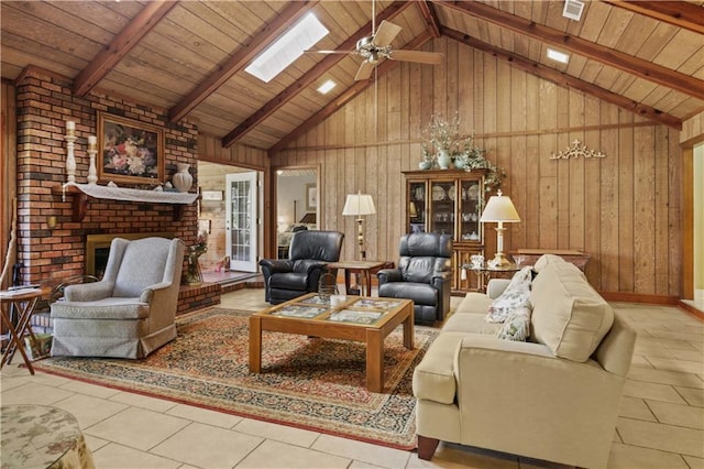 living room with a brick fireplace, high vaulted ceiling, wooden walls, and beamed ceiling