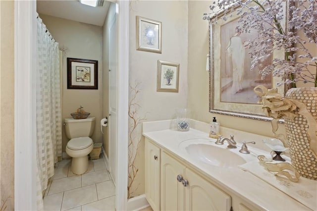 bathroom featuring toilet, tile patterned floors, and vanity