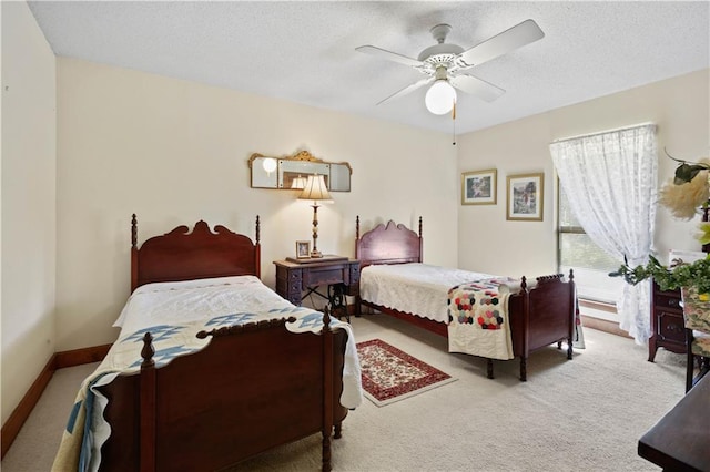 bedroom featuring ceiling fan and light colored carpet