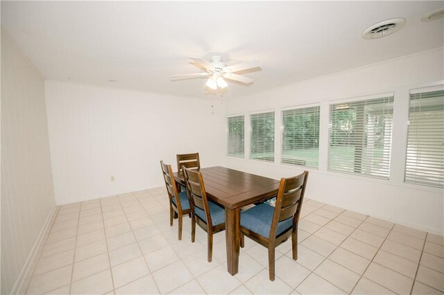 tiled dining room with ceiling fan