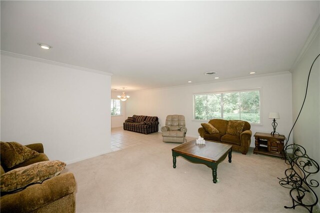 living room with light carpet, a healthy amount of sunlight, a notable chandelier, and crown molding