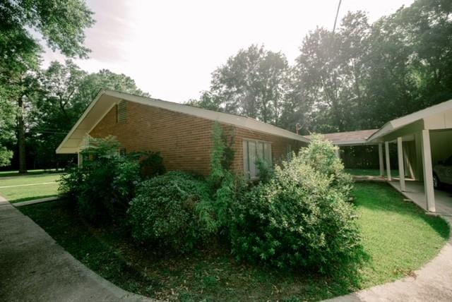 view of home's exterior featuring a lawn