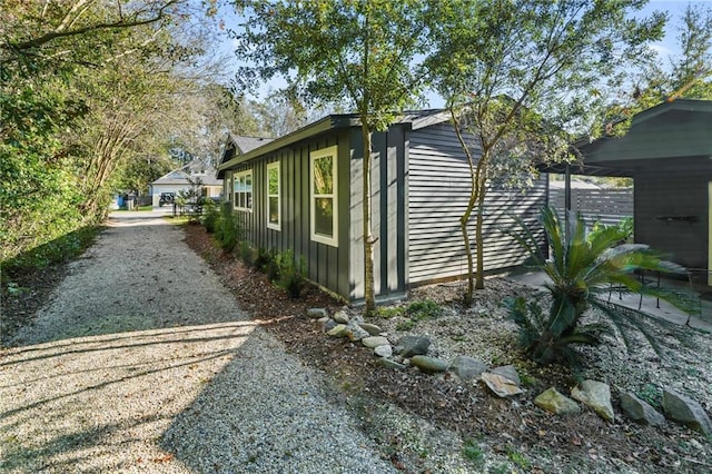 view of property exterior featuring a carport