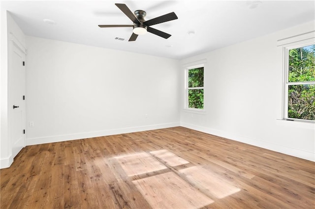 empty room featuring ceiling fan and light hardwood / wood-style floors