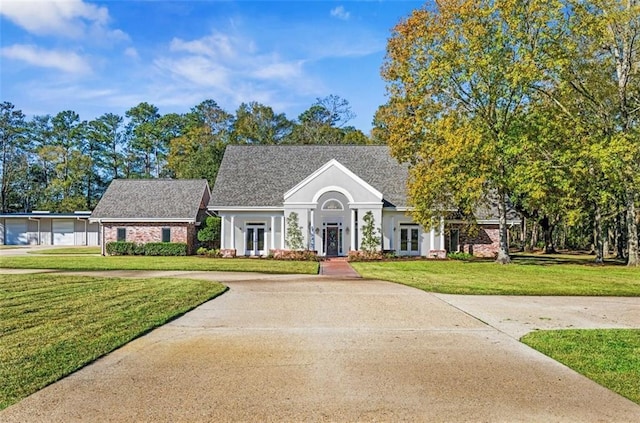 view of front of property featuring french doors and a front yard