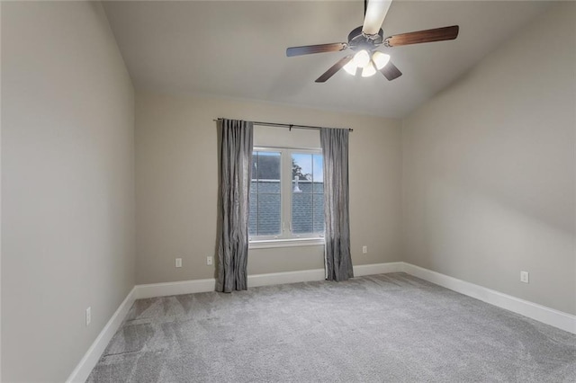 empty room with ceiling fan and light colored carpet